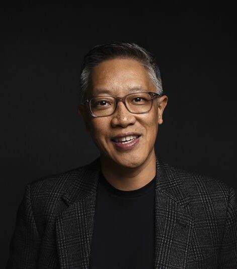 A professional headshot of Tim Leow.